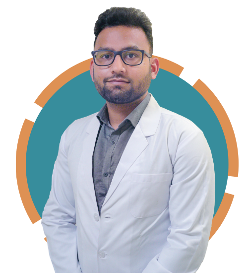 A doctor in a white coat standing in front of a colorful background.